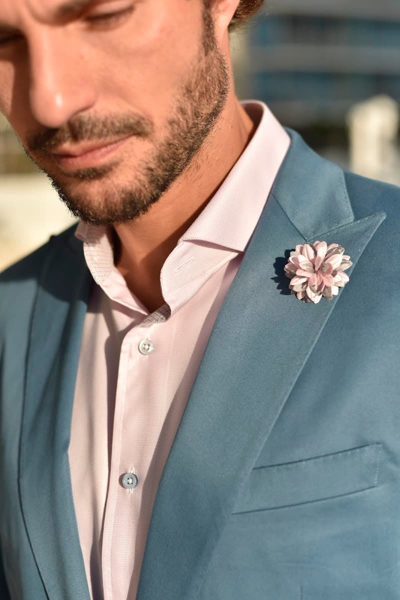 Slate blue blazer with boutonniere lapel detail showcasing Italian-inspired custom tailoring by Bespoke By CB Miami