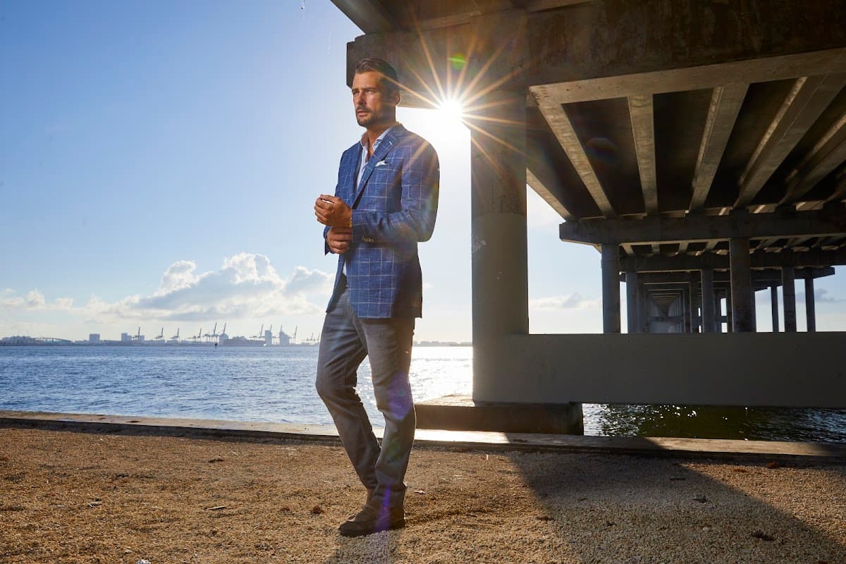 Elegantly dressed man in a tailored linen suit, dressed for a Miami yacht event