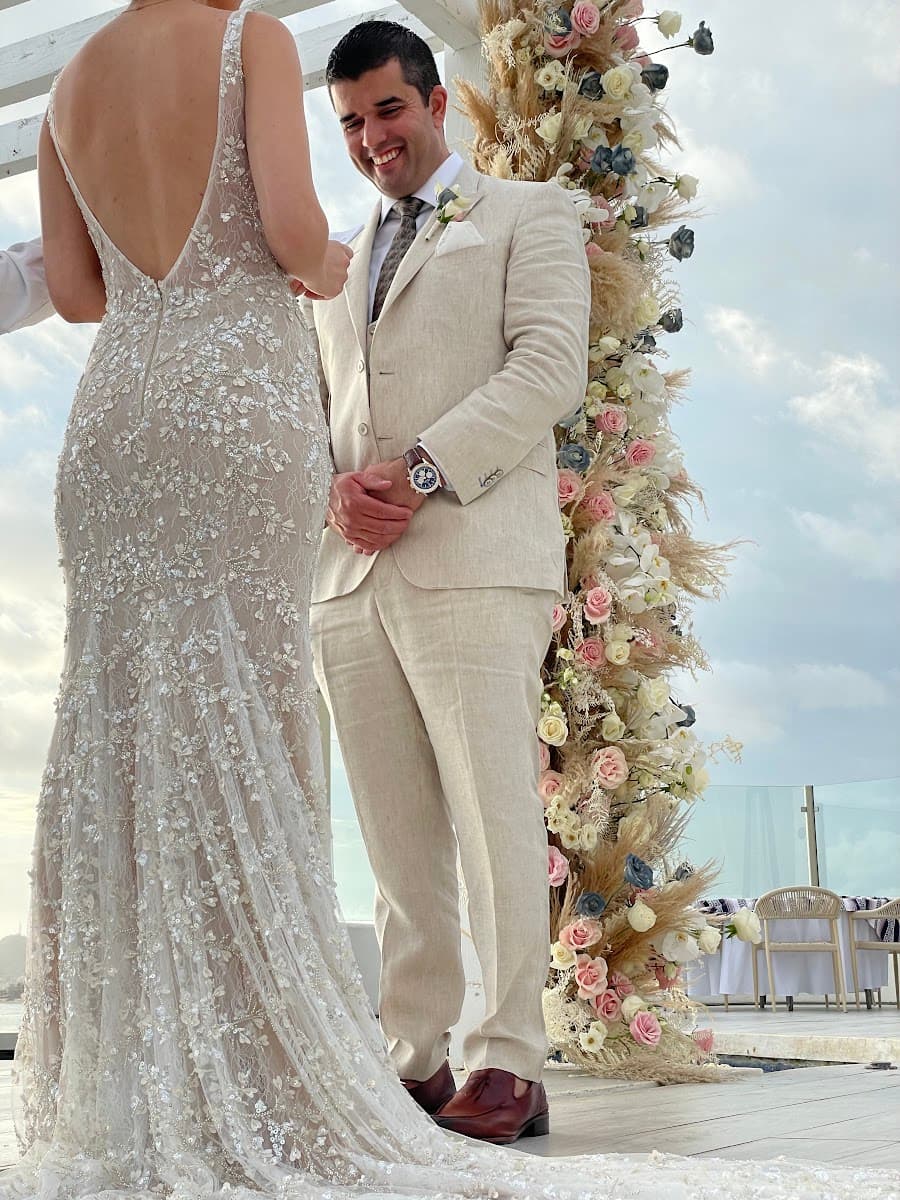 Man wearing a light-colored custom suit perfect for ivory styling