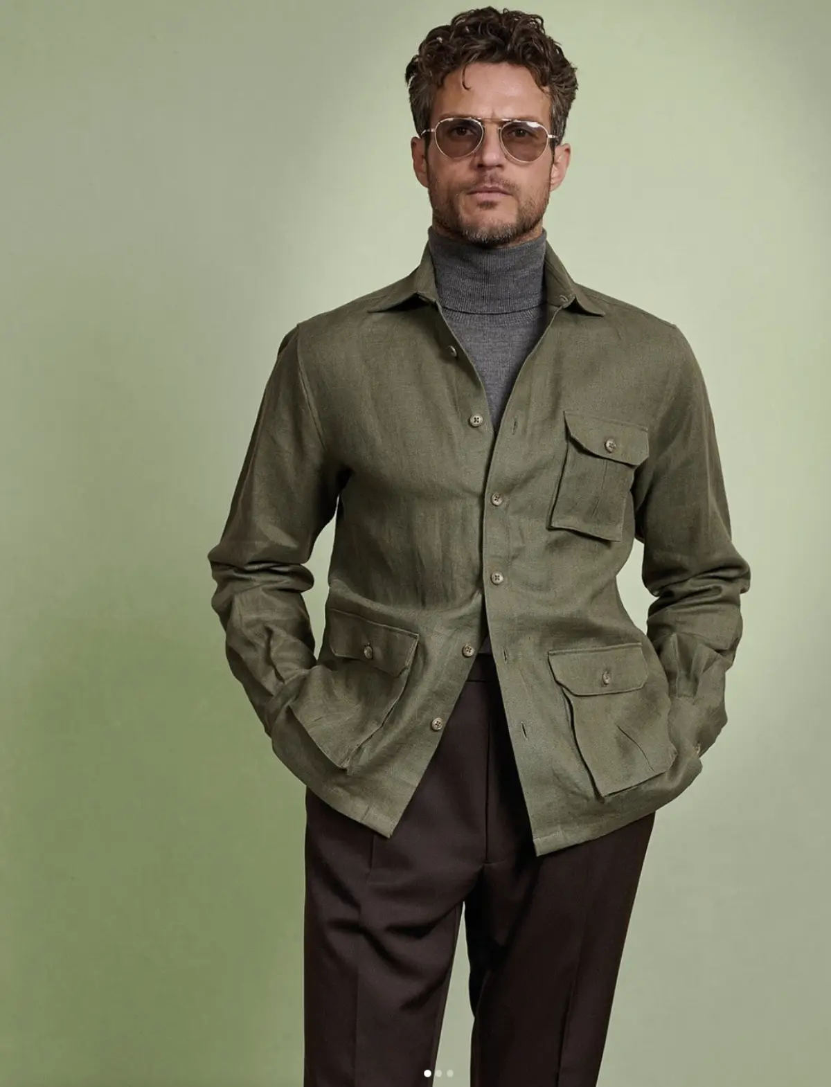 Olive green linen shirt jacket overshirt styled over a turtleneck for a polished layered look