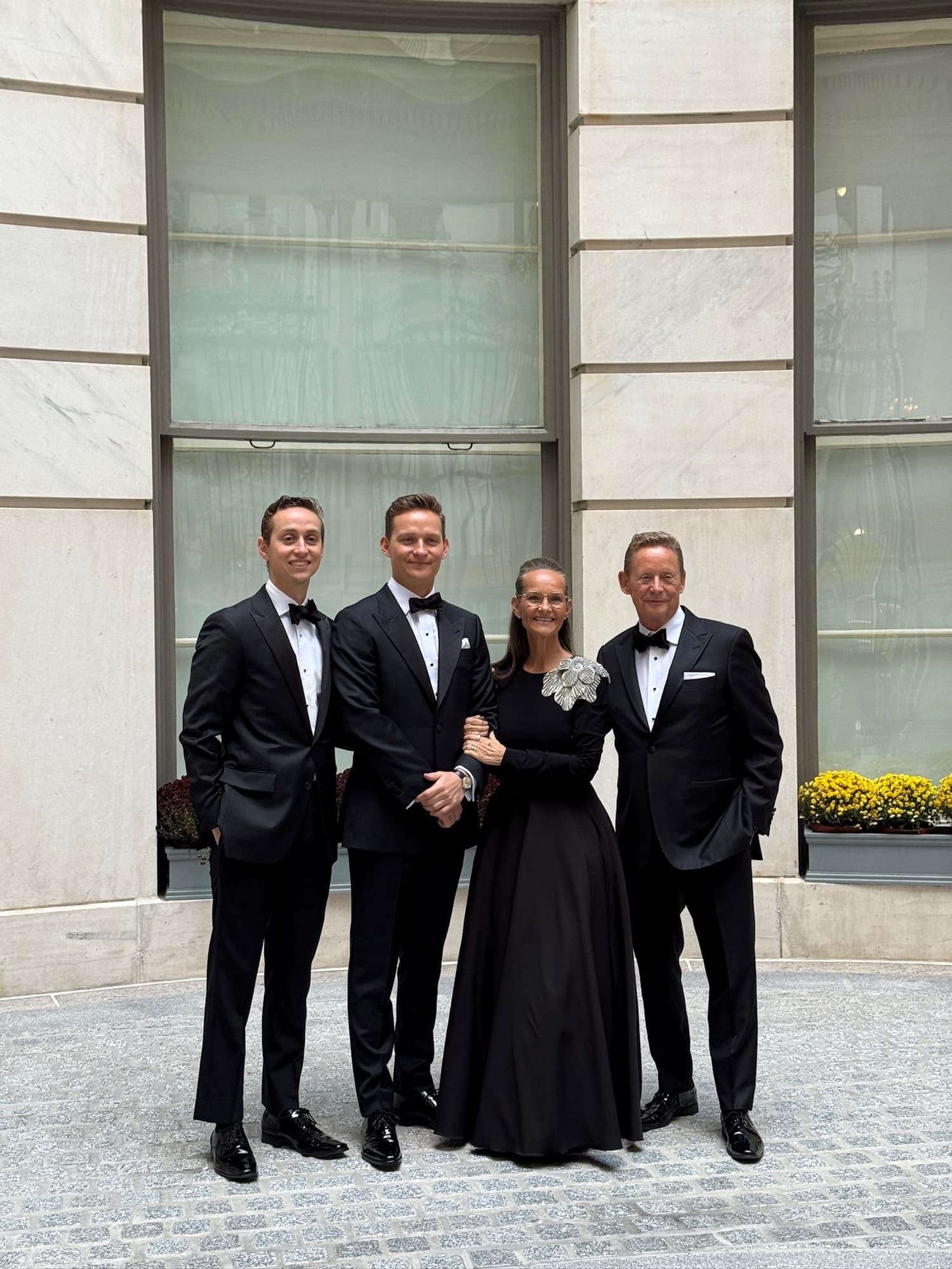 Groom and groomsmen in coordinated custom suits by Bespoke By CB Miami