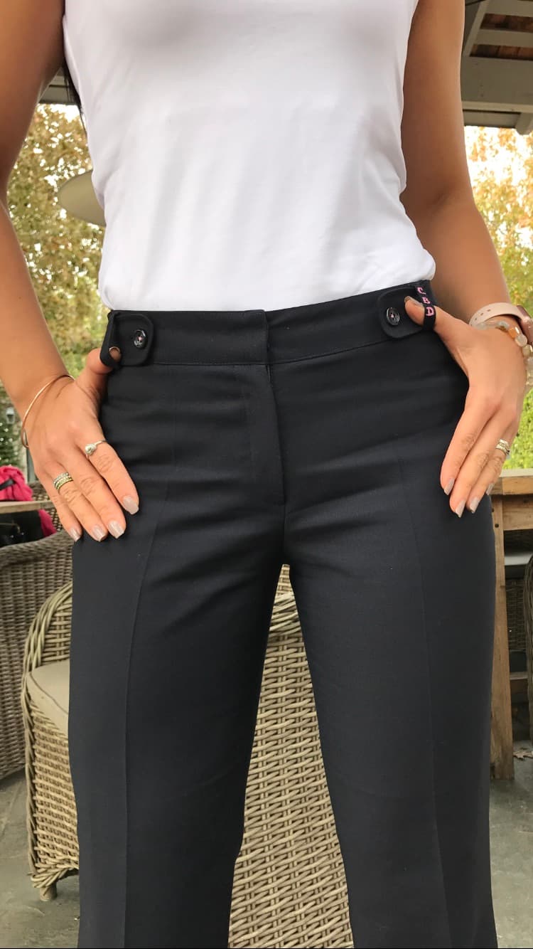 Women's custom high-waisted black trousers with pink embroidered initials detail by Bespoke By CB Miami
