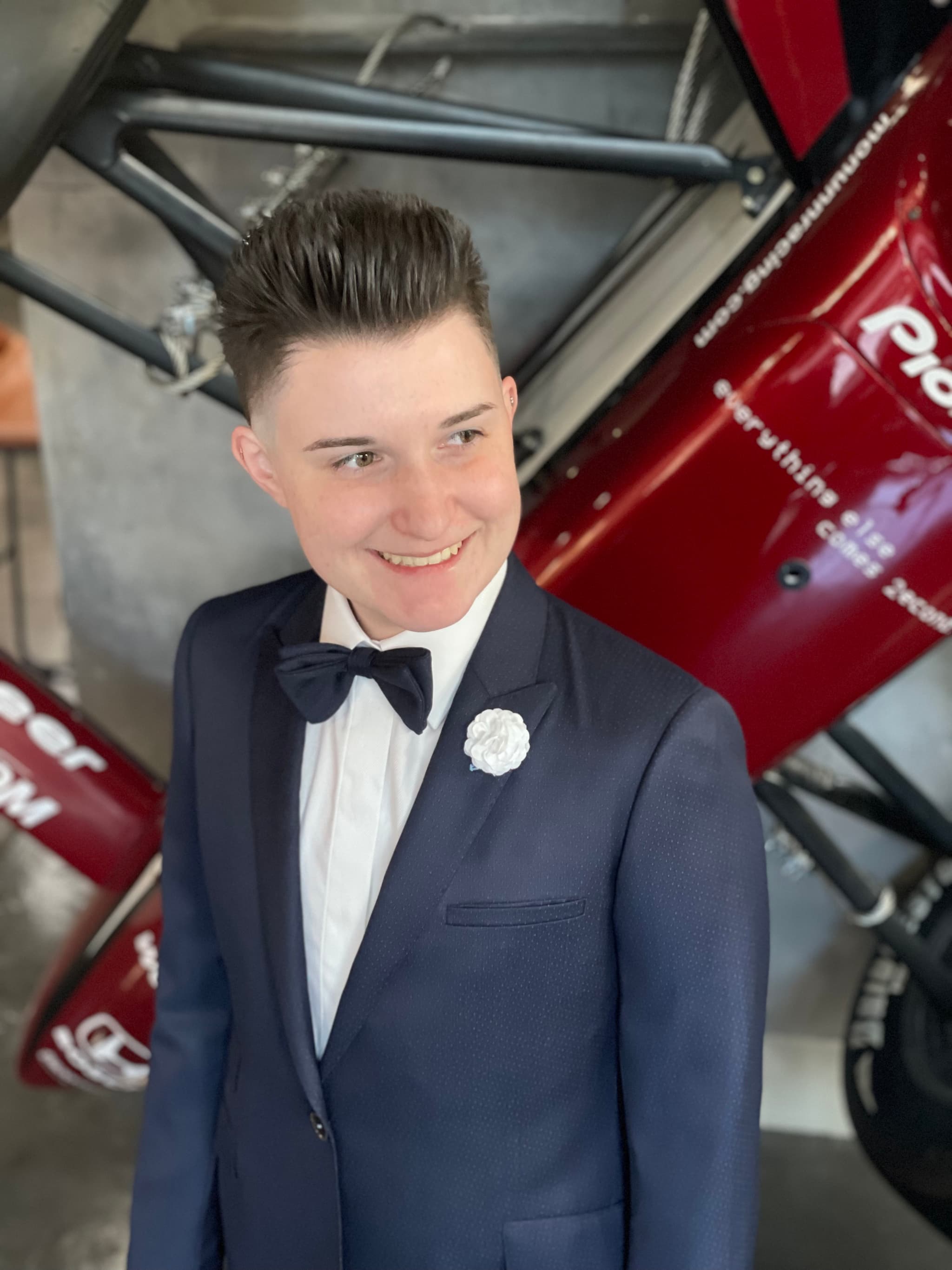 Women's custom navy suit with boutonniere by Bespoke By CB Miami