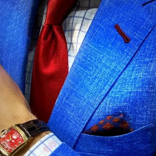 Navy blazer with red tie and luxury watch styled for work by Bespoke By CB Miami