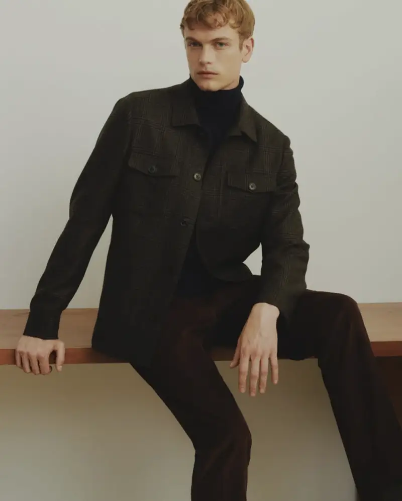 Glen plaid wool overshirt layered over a navy turtleneck