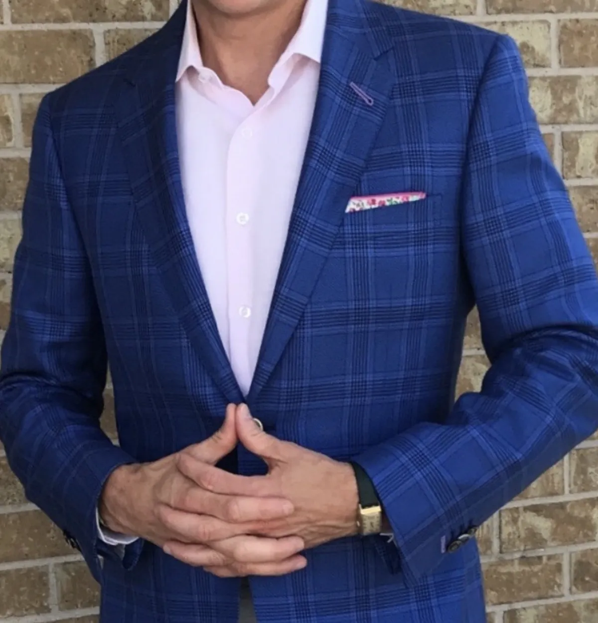 Man wearing a custom blue suit tailored by Bespoke By CB South Florida