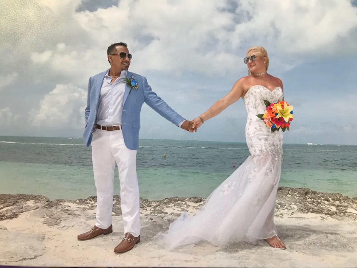 Man wearing a custom blue suit tailored by Bespoke By CB South Florida