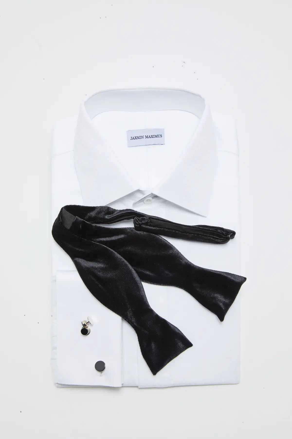Bow tie styling with custom black tie formalwear by Bespoke By CB South Florida