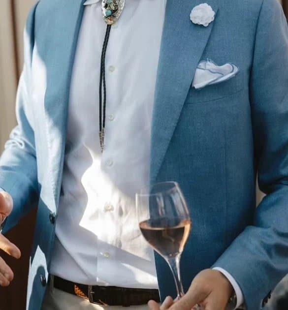 Man wearing a light blue custom suit for a summer wedding in Miami