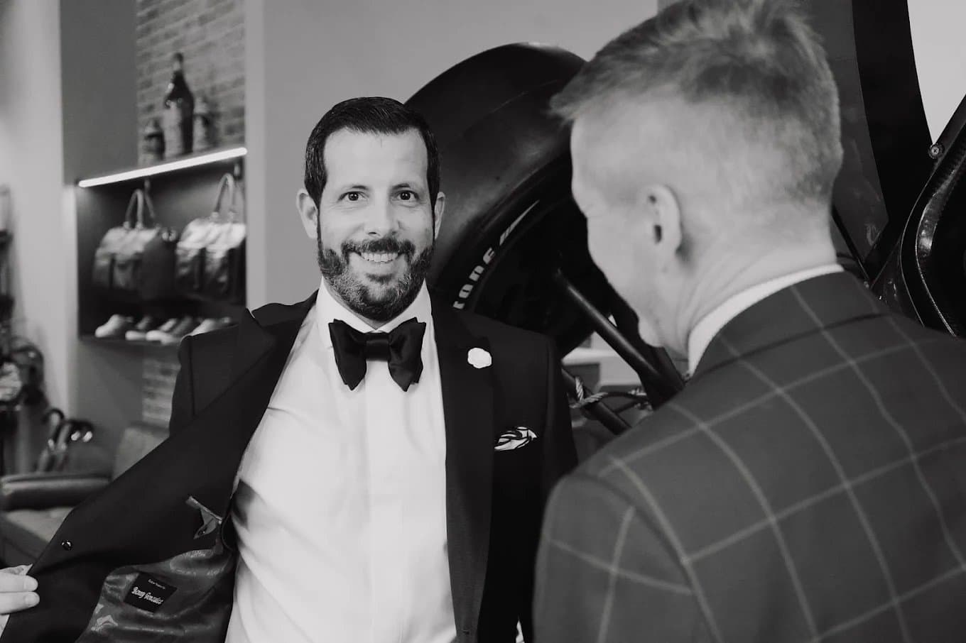 Christian Boehm, master clothier at Bespoke By CB, consulting with a client on a custom suit in Miami
