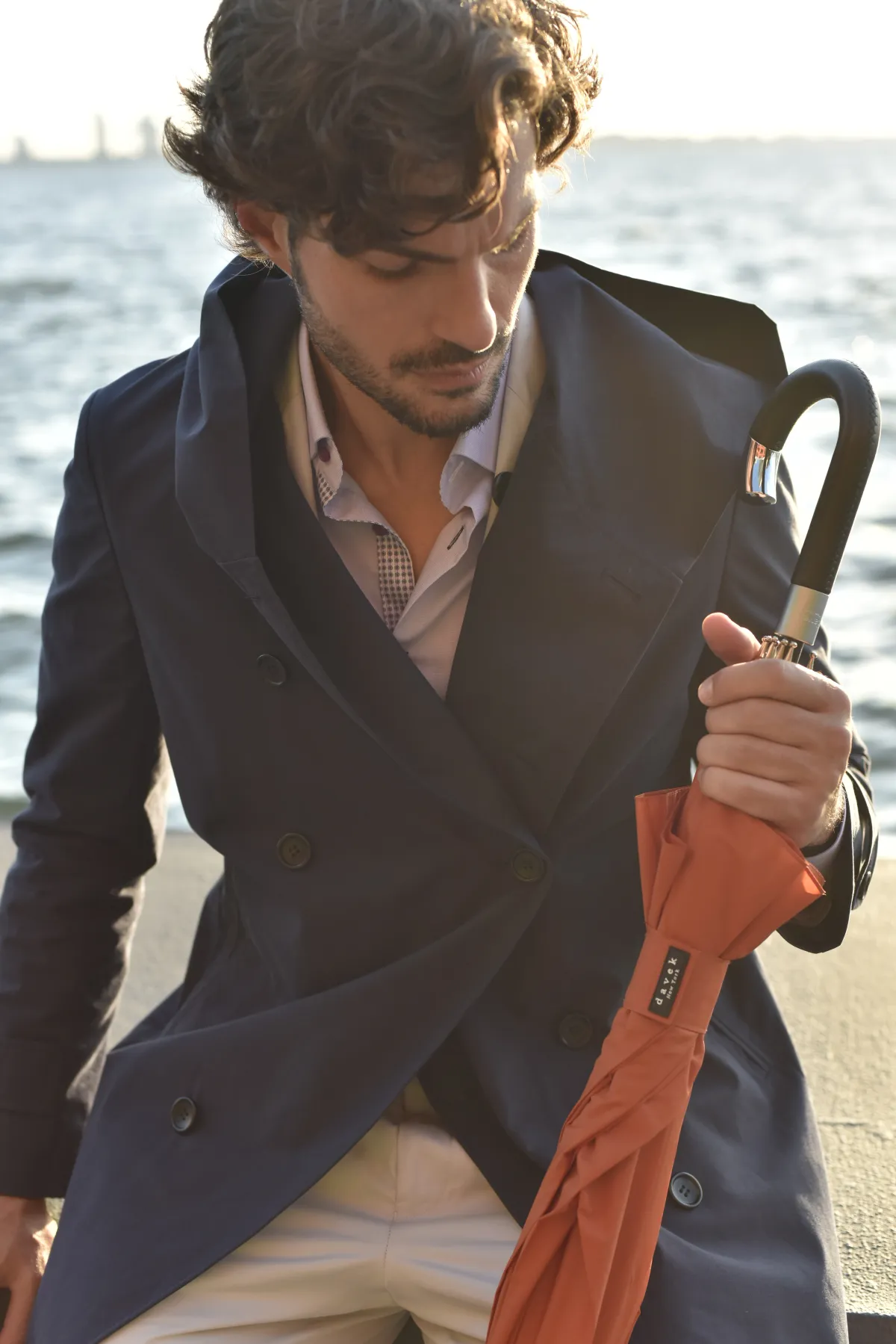 Custom navy double-breasted coat by Bespoke By CB Miami & Fort Lauderdale — hooded raincoat with umbrella styling