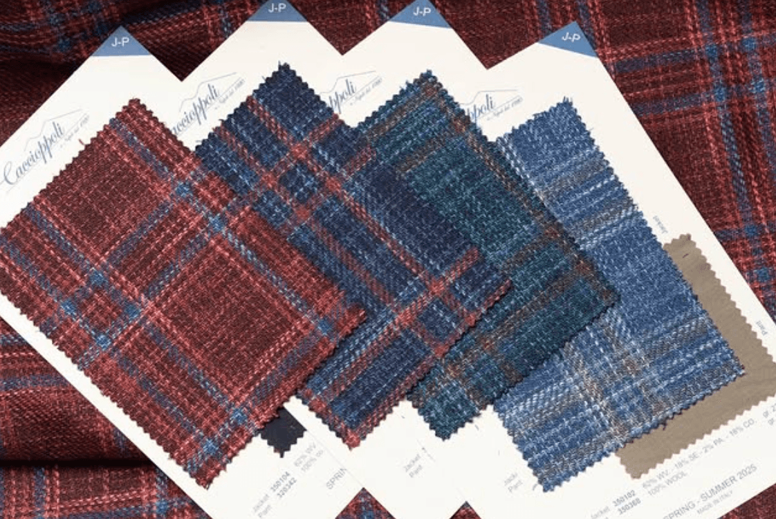 Caccioppoli plaid and tartan fabric swatches in burgundy, navy, and charcoal tones
