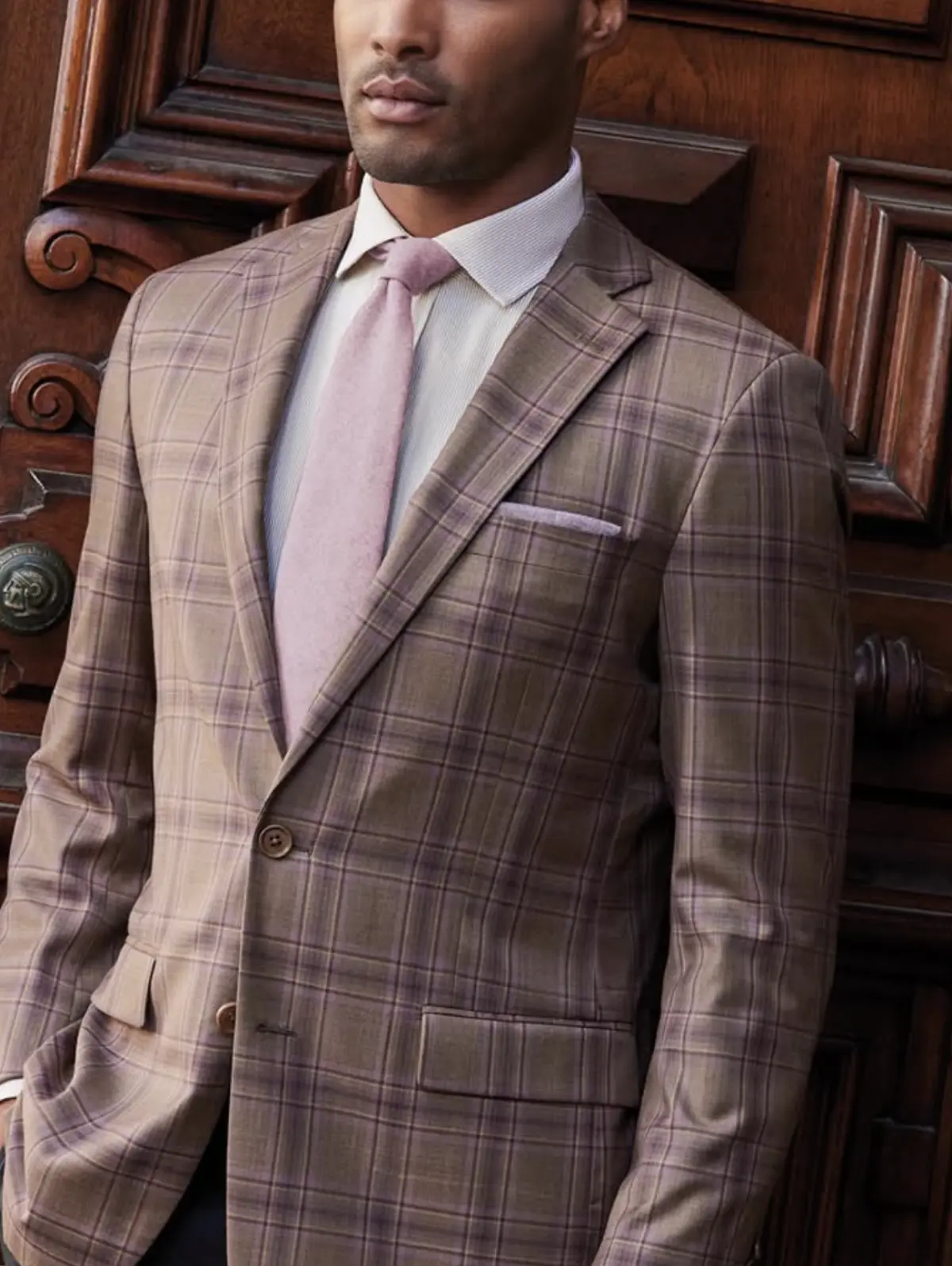 Man wearing Carlo Barbera light pink and mauve plaid blazer with patterned tie — Italian luxury fabric