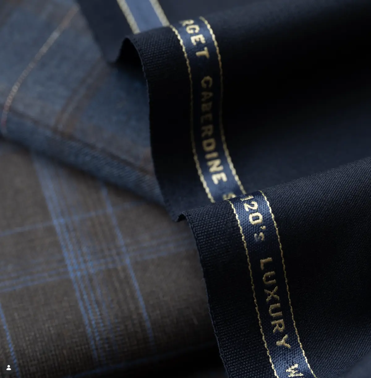 Holland & Sherry Super 120s blue plaid and navy suiting fabric with luxury selvedge labels