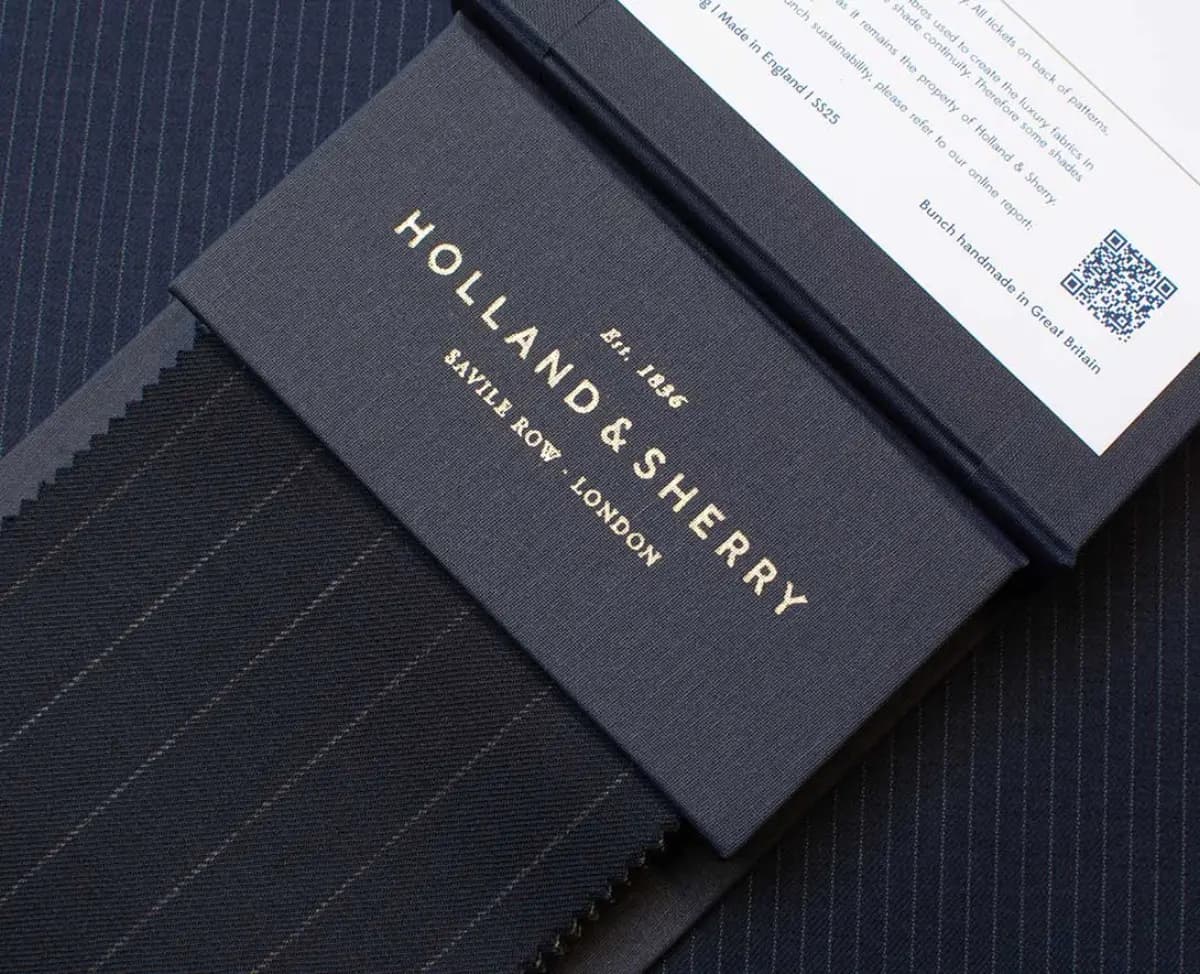 Holland & Sherry luxury fabric swatch book with gold foil lettering — Est. 1836 Savile Row London