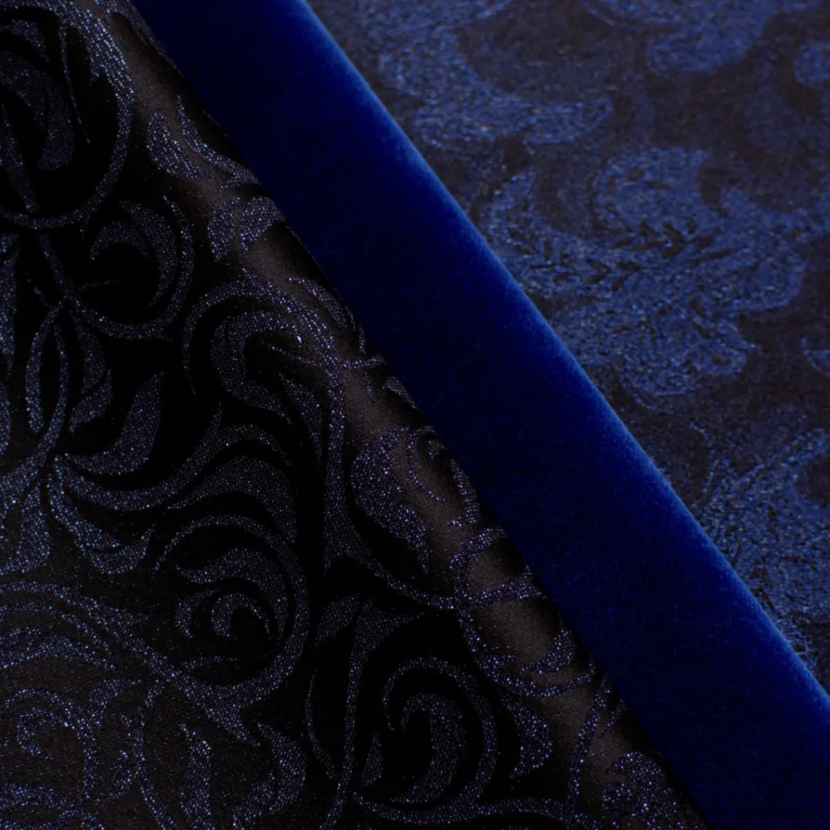 Holland & Sherry luxury fabric selection — royal blue velvet, metallic brocade, and jacquard textiles