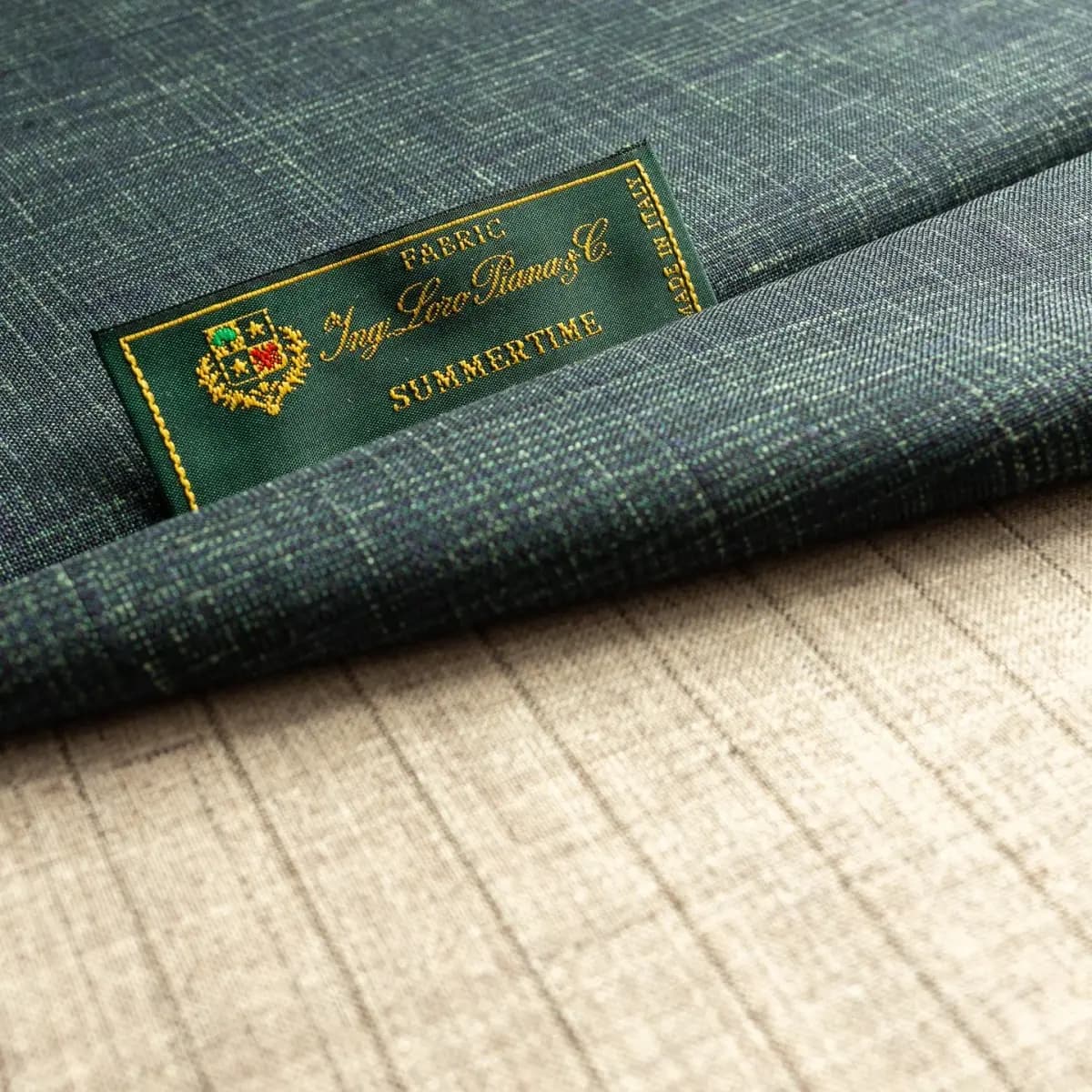 Loro Piana Summertime teal micro-check fabric roll with green label — lightweight Italian wool
