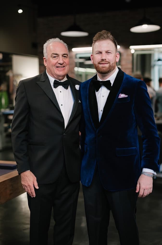 Father and groom in tuxedo and blue velvet dinner jacket by Bespoke By CB Miami