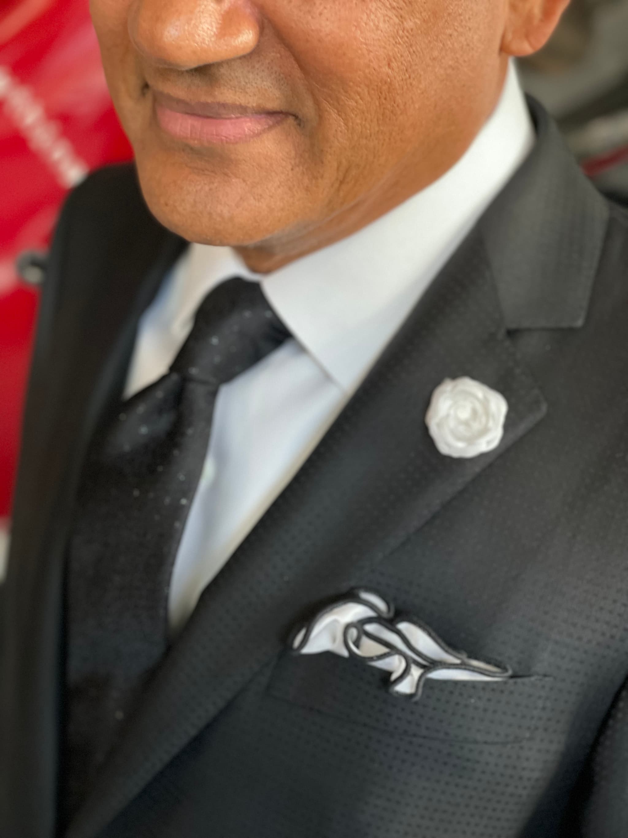 Close-up of father of the bride tuxedo lapel with boutonniere and pocket square by Bespoke By CB Miami