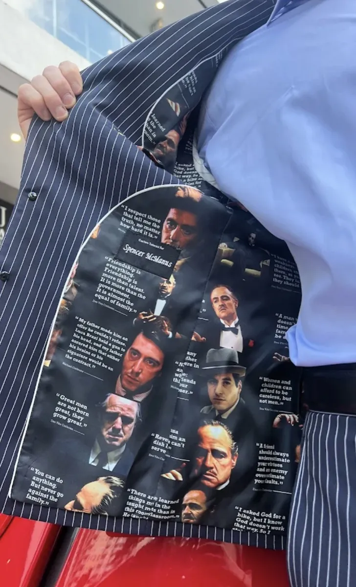 Custom pinstripe suit jacket with Godfather movie themed lining featuring character portraits and iconic quotes, Bespoke By CB Miami