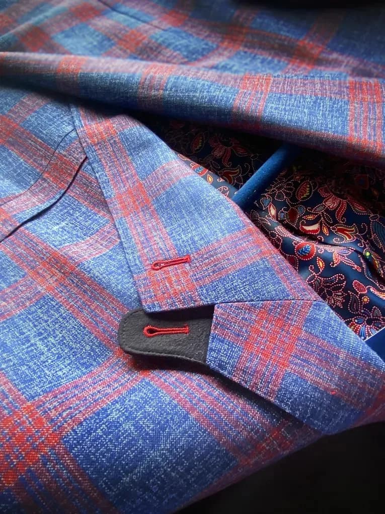 Close-up detail of navy paisley custom lining inside a windowpane suit jacket, Bespoke By CB Miami