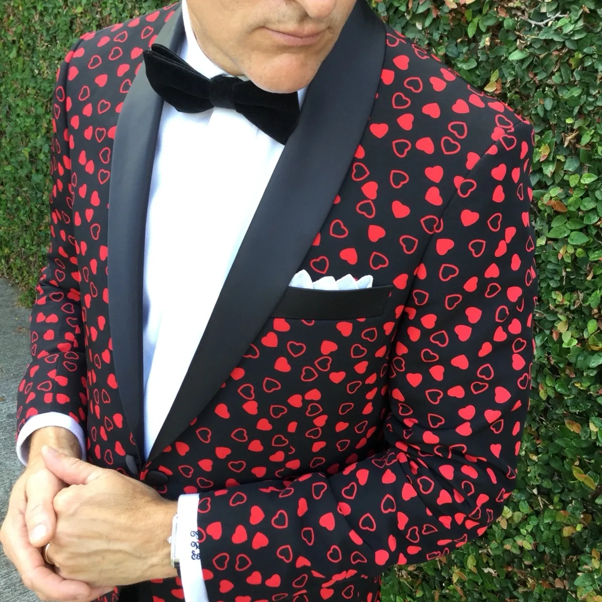 Custom heart-print Valentine's Day tuxedo jacket by Bespoke By CB — black jacket with red hearts and satin lapels