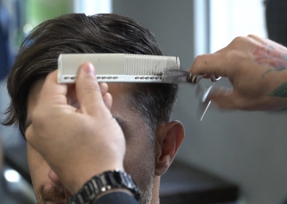 Man getting a hair cut, previously had hair botox