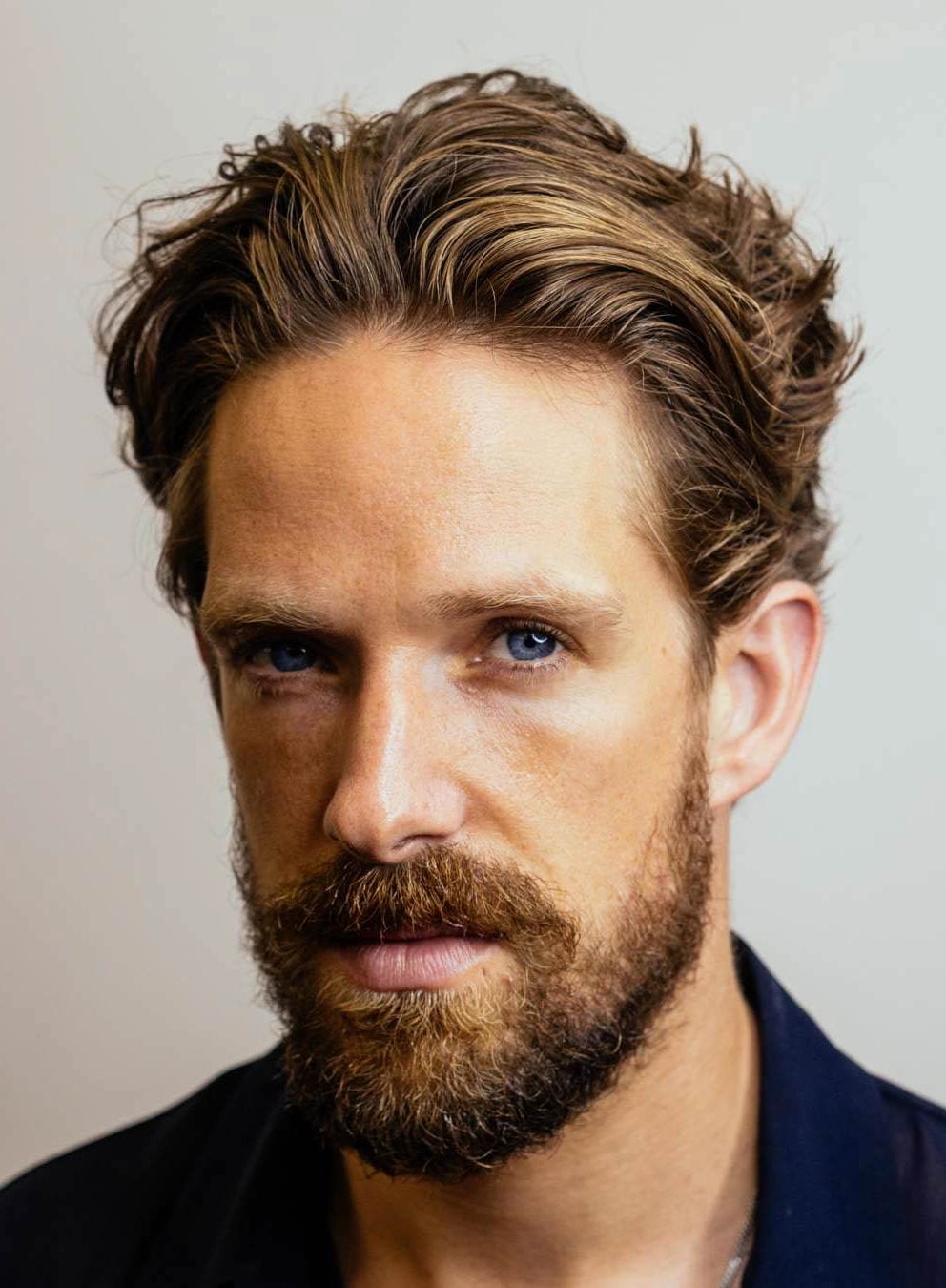 HAIRCUTS FOR MEN WITH CURLY HAIR slick back